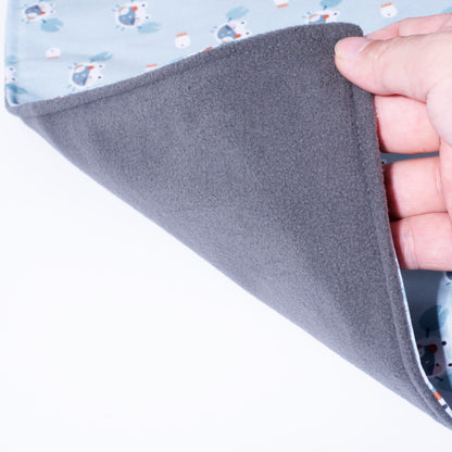 A close-up view showing the dark gray bamboo charcoal layer and the thin water repellent changing pad for travel with no inner foam padding.